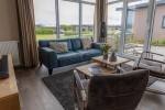 Chalet-12-woonkamer1-robbenjager-texel-2024-Hersteld.jpg